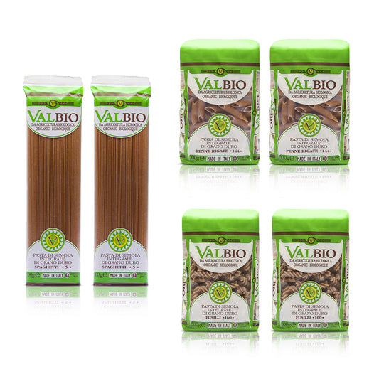 Assortimento di pasta biologica integrale Valbio da 500g: due confezioni di spaghetti, due di penne rigate e due di fusilli, disposte su sfondo bianco.