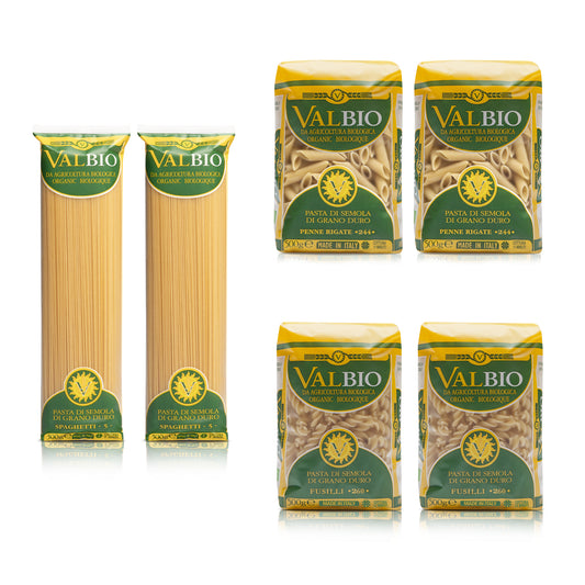 Assortimento di pasta biologica Valbio in confezioni da 500g: due pacchi di spaghetti, due di penne rigate e due di fusilli, disposti su sfondo bianco.