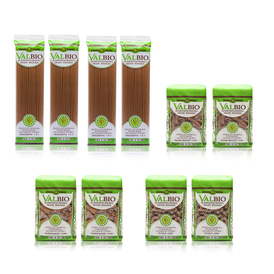 Assortimento di pasta biologica integrale Valbio in confezioni da 500g: quattro pacchi di spaghetti, due di penne rigate, una di tortiglioni e tre di fusilli, disposti su sfondo bianco.